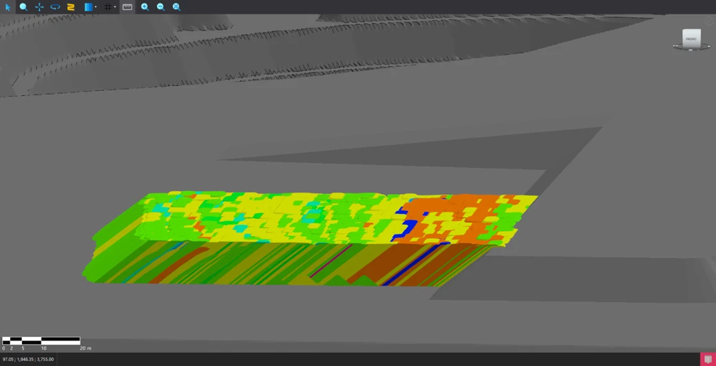 Cross-section of a 3D ROM stockpile model showing material layers formed by successive truck dumps.